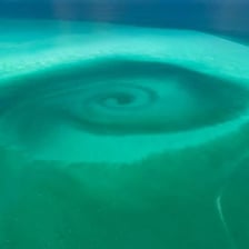 A visible swirling eddy in a river