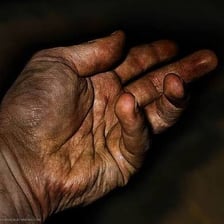 Hands visibly covered with grime.