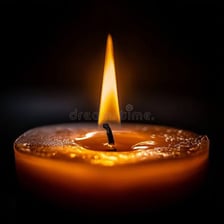 A candle burning with a visible flame