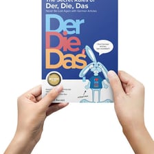 A German-language lesson showing the articles der, die, and das.