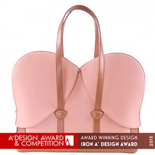 A conceptual award trophy beside a designer handbag