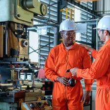 A workplace safety inspector examining an industrial site.
