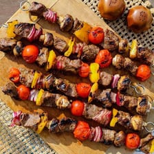 Grilled shish kebab skewers with meat and vegetables.