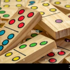 A close-up of domino tiles showing their pip markings