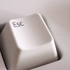 A keyboard showing the Esc key in the upper-left corner