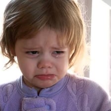 A person crying intensely.