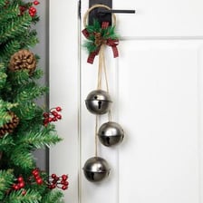 A pair of shiny silver bells used as a holiday decoration