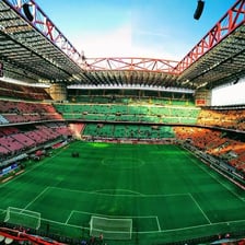 AC Milan players on a football pitch at San Siro.