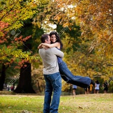 Two people embracing in a tight bear hug.