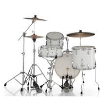 A drum set showing taut drumheads stretched across its shells.