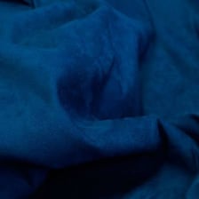 Close-up view of the soft napped surface of suede fabric