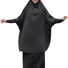 A woman wearing a modest abaya robe