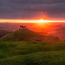 A landscape showing the progression from sunrise toward sunset