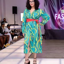Fashion models walking a runway, shown full length.