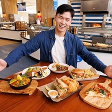 Food offerings arranged in a dining hall buffet