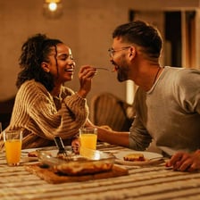 A couple enjoying a romantic dinner together.
