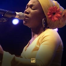 Singer India.Arie performing on stage.