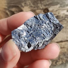 A rock sample containing visible metallic ore