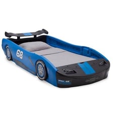 A child-sized bed designed to look like a race car.