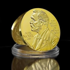 A portrait of Alfred Nobel beside a Nobel Prize medal