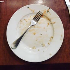 An empty plate showing that a meal has been completely eaten.