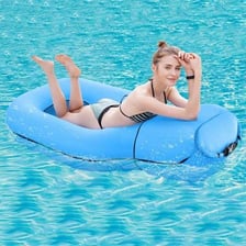 An inflatable raft floating on a swimming pool.