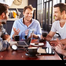 A group of men talking together.