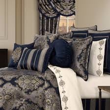 A decorative pillow sham arranged on a bed.
