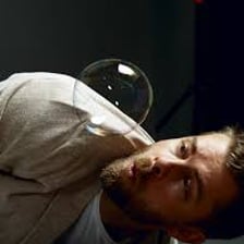 A person searching inquisitively through a collection of objects