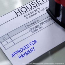 An approval stamp pressed onto a document.
