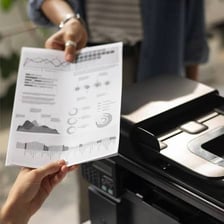A printer producing a paper document.
