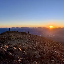 A mountain summit representing a highest point.