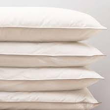 A close-up photograph of a soft pillow.