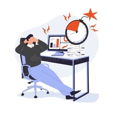 A person sitting around idly while work remains unfinished