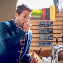 A person burping after a meal.