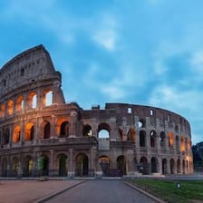 A visitor looking up at a spectacular landmark in amazement.