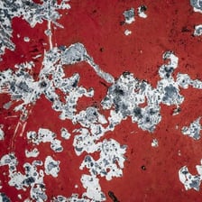 An object with a visibly scratched and damaged surface