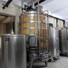 A large vat used for fermenting or holding wine at a winery.