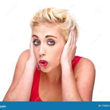 A person covering their ears to avoid hearing an unwanted conversation