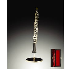 A black oboe with its keys and reed visible