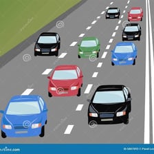 Several cars traveling and parked on a city road.
