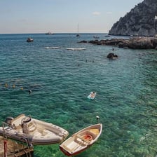 The rocky coastline and blue waters of the Isle of Capri
