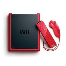 A Nintendo Wii console beside its Wii Remote controller.