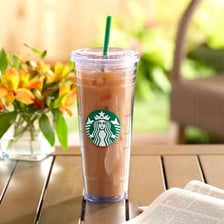 A Starbucks cup labeled with the Venti drink size.
