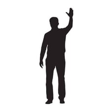 A person waving goodbye while departing.