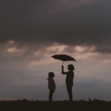 One person supporting another person who is relying on them