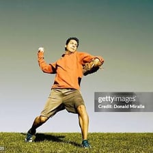A person forcefully throwing a ball