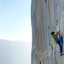 A person laboring up a steep, difficult trail.