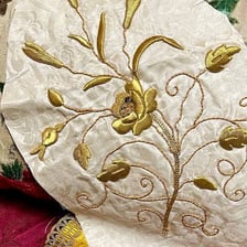 A piece of fabric decorated with elaborate embroidery