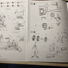 A hobby model kit containing project parts and instructions